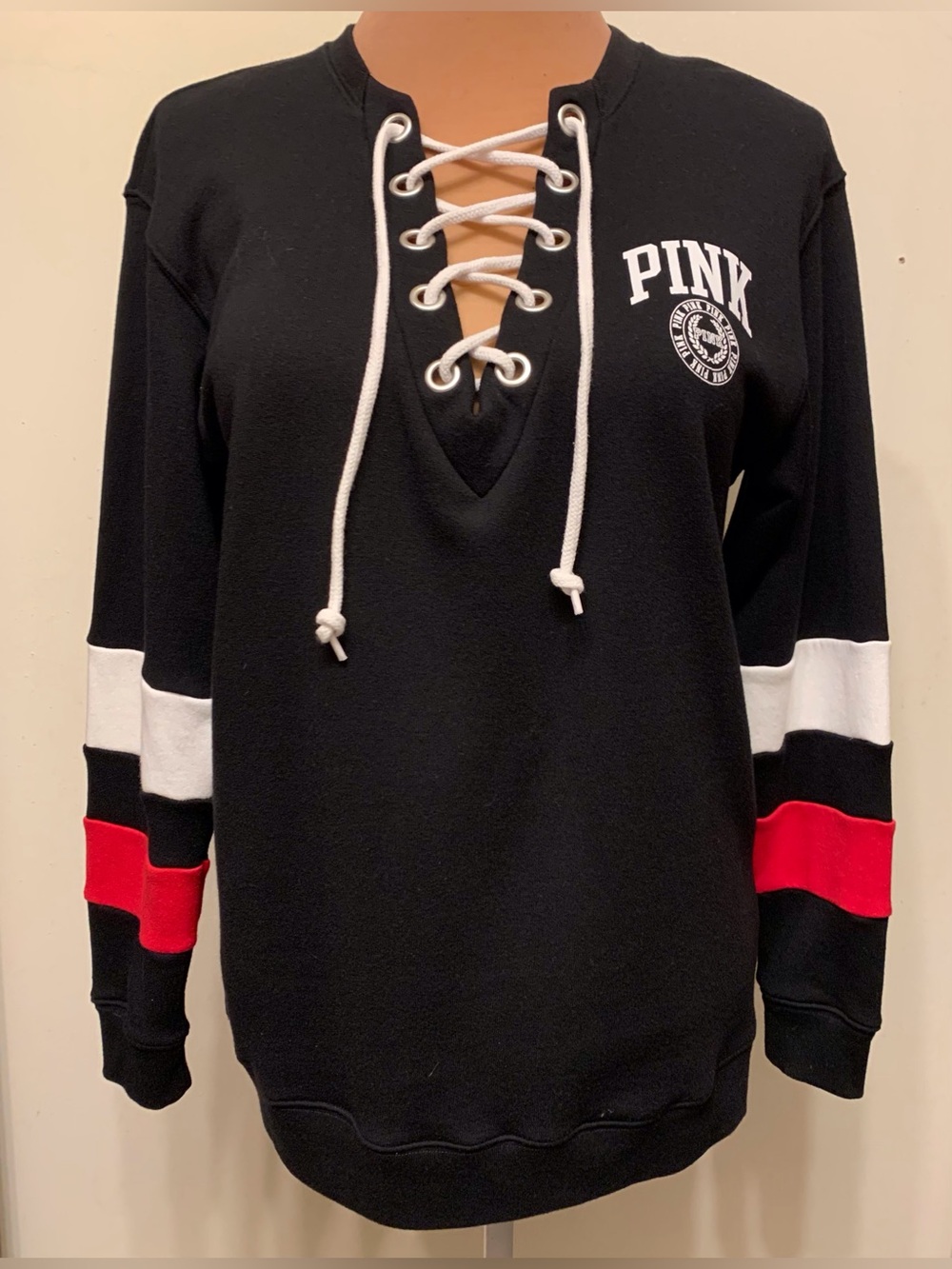 PINK Victoria's Secret Black Lace-Up Pullover with White and Red Sleeve Stripes